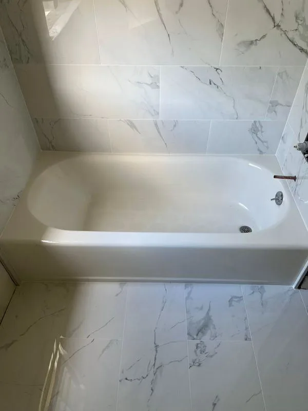Completed white bath with tiled surround