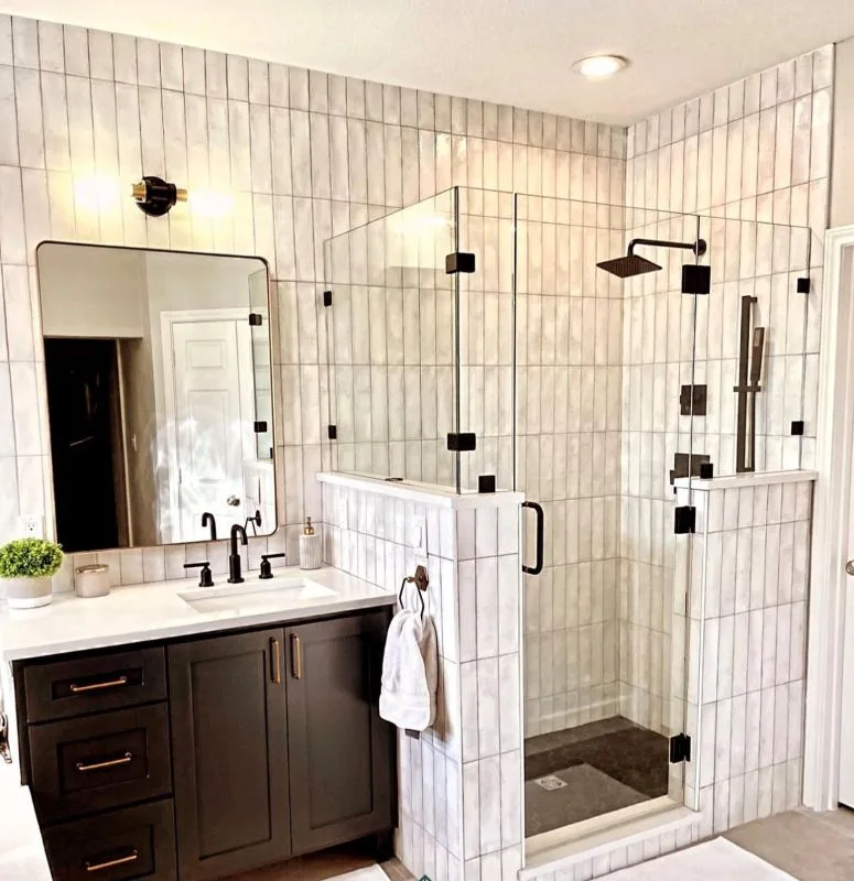 Completed bathroom with a dark timber double vanity