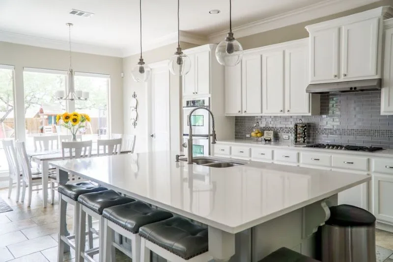 Kitchen with a large island and white cabinetry