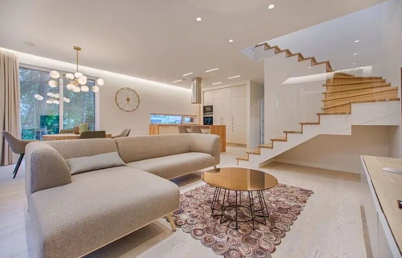 Open plan living area with timber stairs