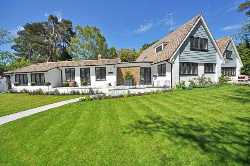 House exterior with a pitched roof and front lawn