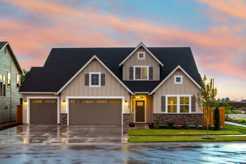House exterior with board siding and a pitched roof