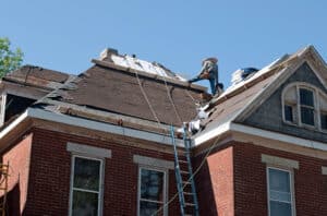 men working on roof renovation